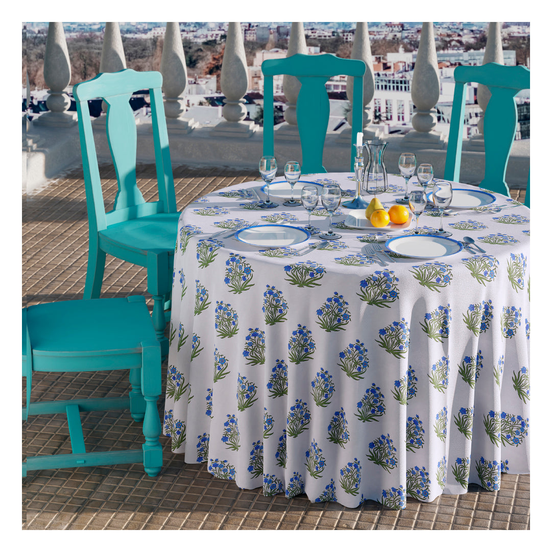 A tablecloth in a yard blue floral print