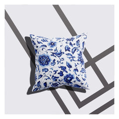 A cushion cover with a white-blue floral design