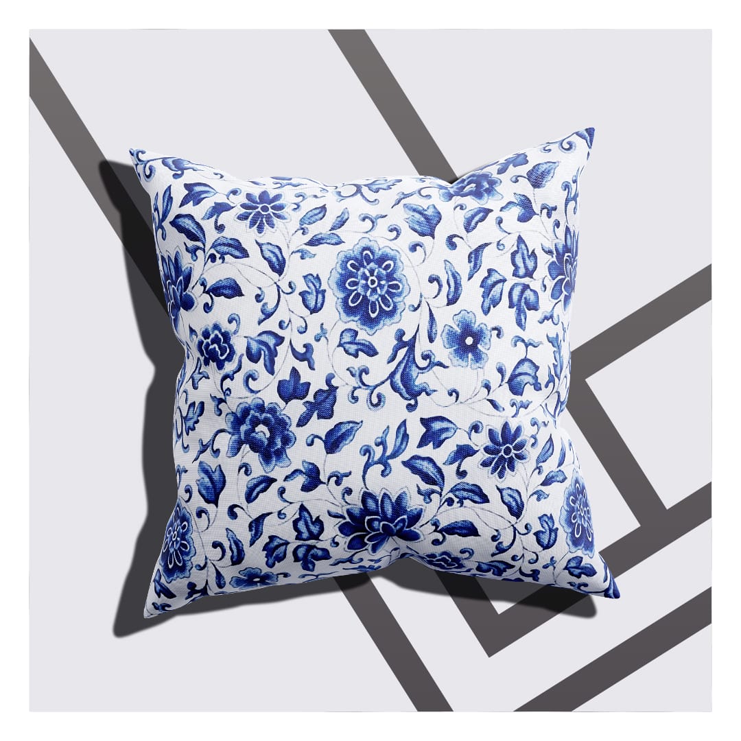 A cushion cover with a flower design and leafy details