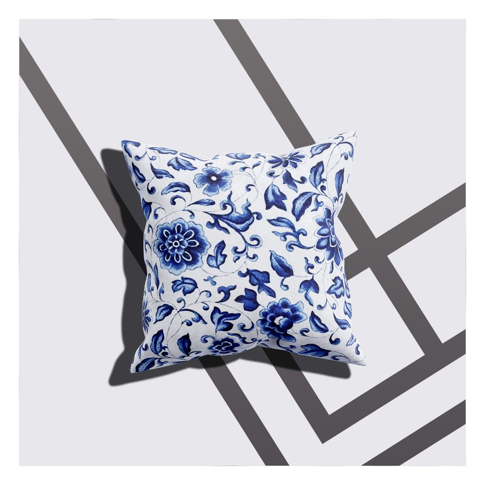 A cushion cover with a white-blue floral design