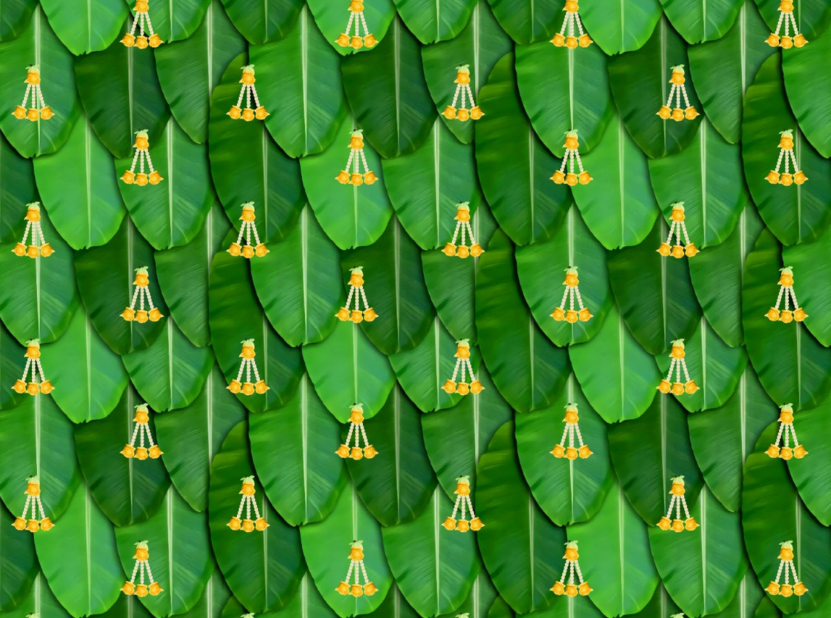 South Indian Backdrop: Texture of Banana leaf with yellow rose tassel